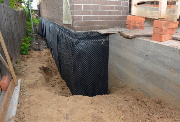 Happy homeowners after waterproofing job in Lexington Park